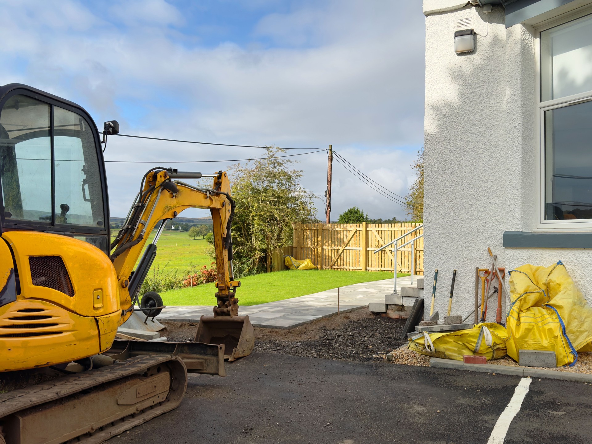 Garden renovation works with new lawn and paving slabs